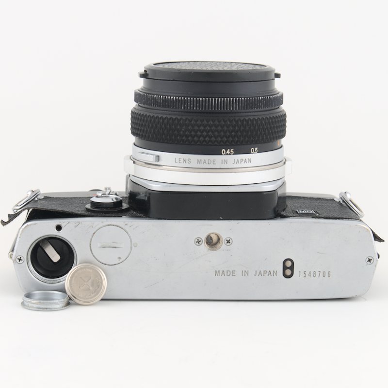 The Olympus OM-1, a classic 35mm SLR camera, uses a now-banned 1.35V mercury battery, though viable alternatives exist that allow it to function effectively without compromising its superior metering system.