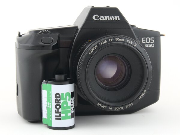 Step by step instructions with pictures on how to load 35mm film into the Canon EOS 650. Start taking photos with your Canon EOS 650 camera.