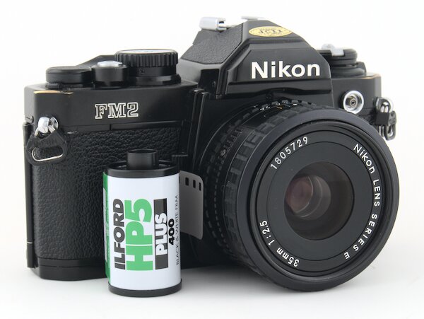 Step by step instructions with pictures on how to load 35mm film into the Nikon FM2. Start taking photos with your Nikon FM2 camera today.