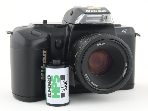 Step by step instructions with pictures on how to load 35mm film into the Nikon N4004. Start taking photos with your Nikon N4004 camera."