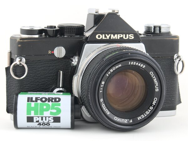Step-by-step how to successfully rewind and remove the film from your Olympus OM-1. Don't expose your film by unloading it incorrectly.