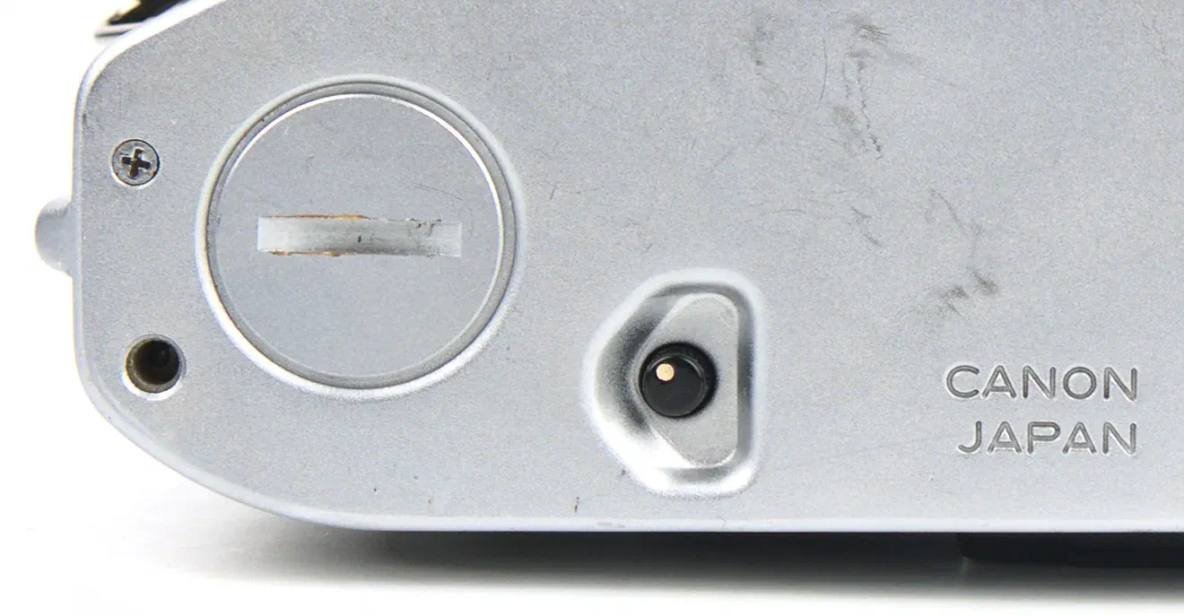 Canon AE-1 film rewind unlock button Canon AE-1 film rewind unlock button