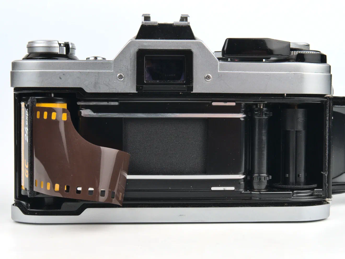 Load film into the Canon AE-1 Load film into the Canon AE-1