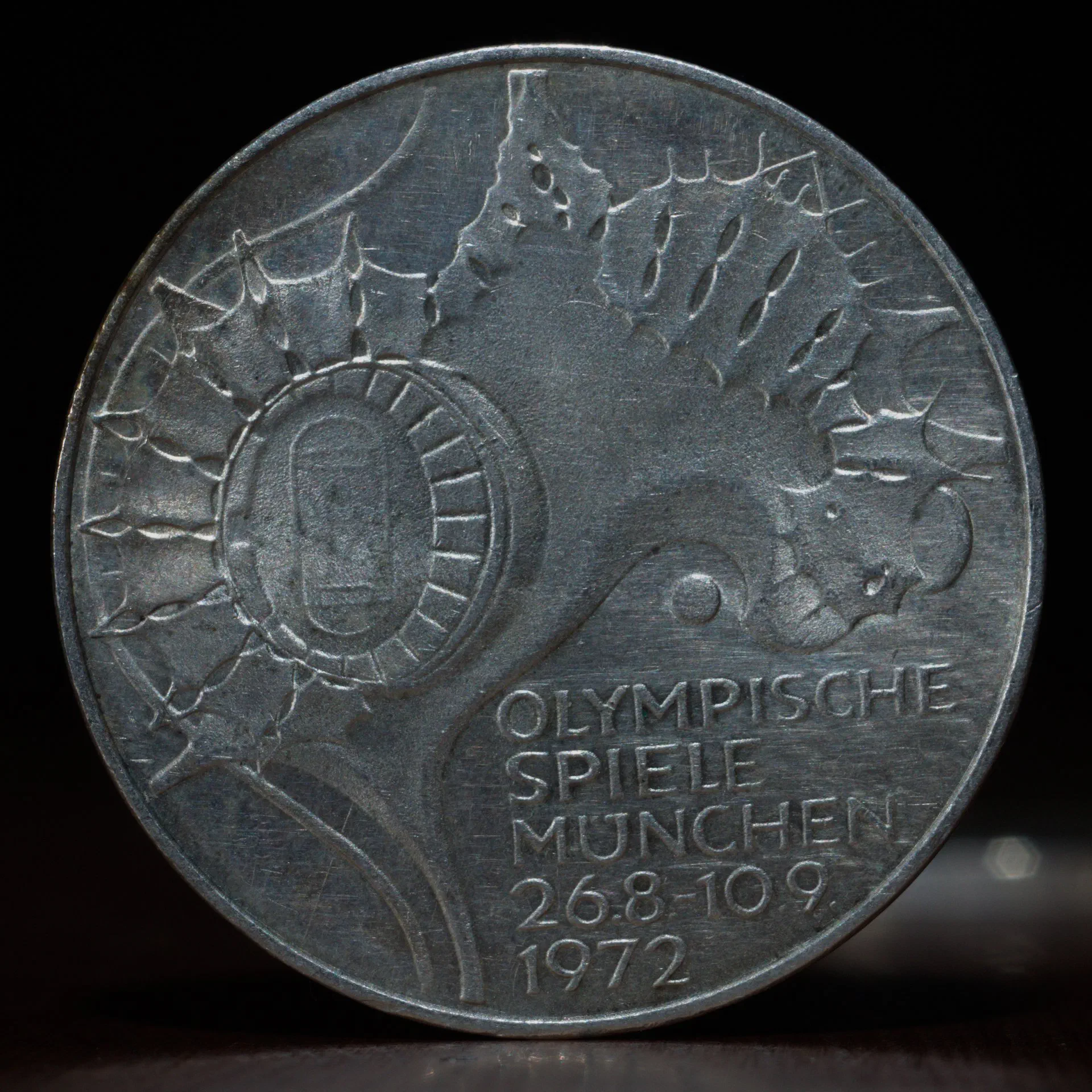 1972 Munich Olympics 10 Mark Coin – Lighting Study 1 1972 Munich Olympics 10 Mark silver coin photographed under controlled lighting to show design detail