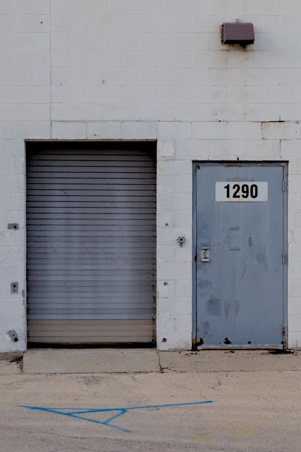 A back door to a closed grocery store.